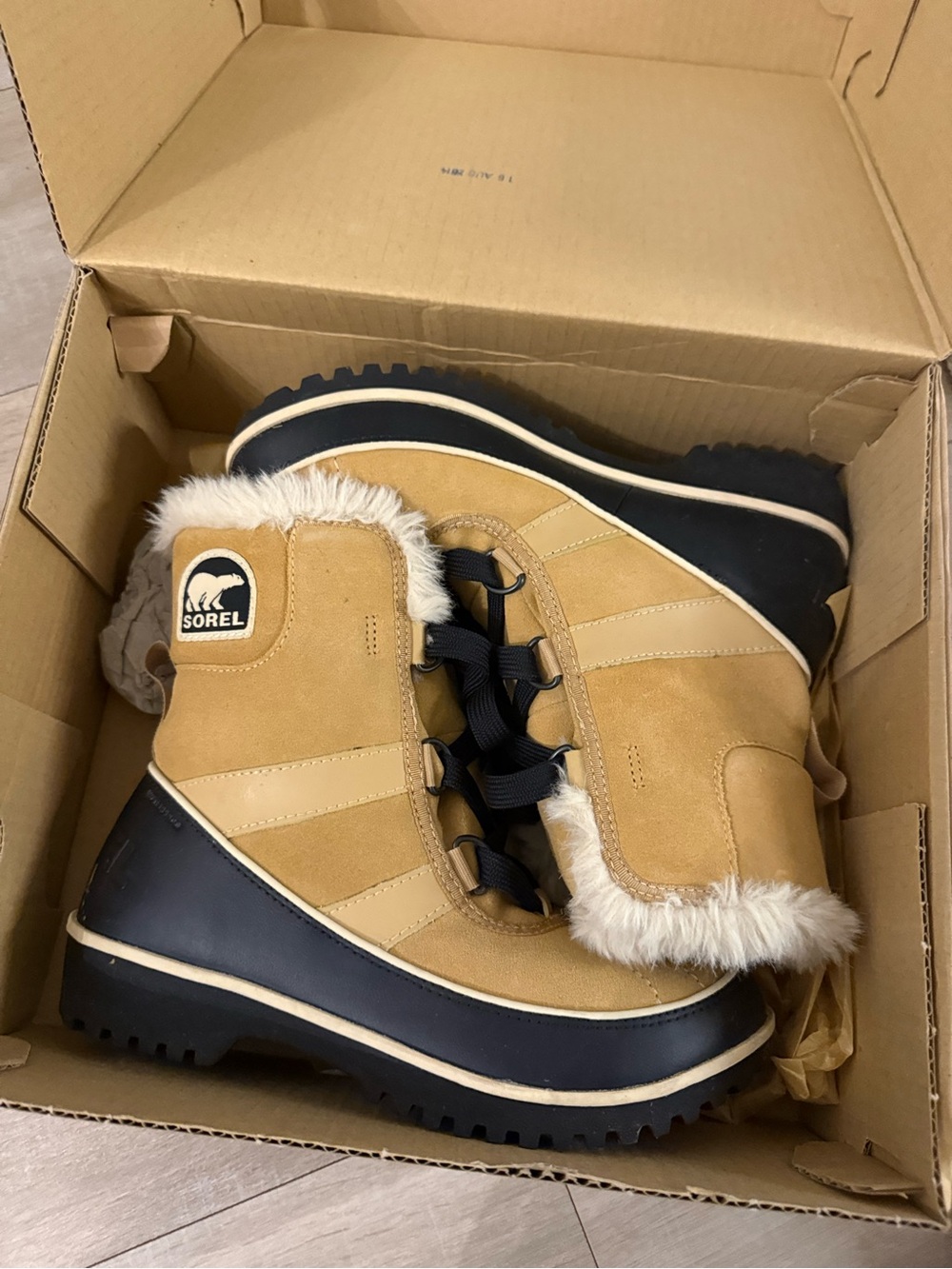 Sorel Tan and Black Faux-Fur Winter Boots